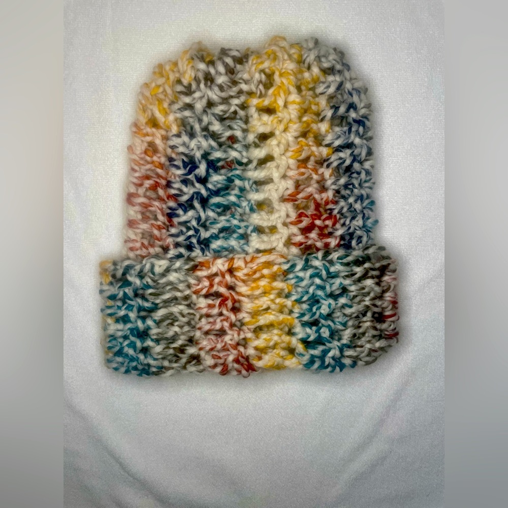 Hand crocheted, medium size yarn beanie.